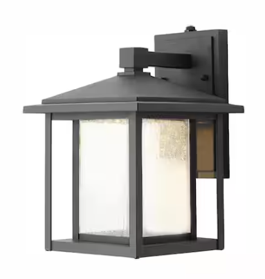 Home Decorators Collection- Mauvo Canyon 11 in. Black Dusk to Dawn Small LED Outdoor Wall Light Fixture Porch Sconce with Seeded Glass